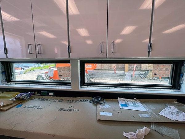 narrow horizonal windows under cabinets