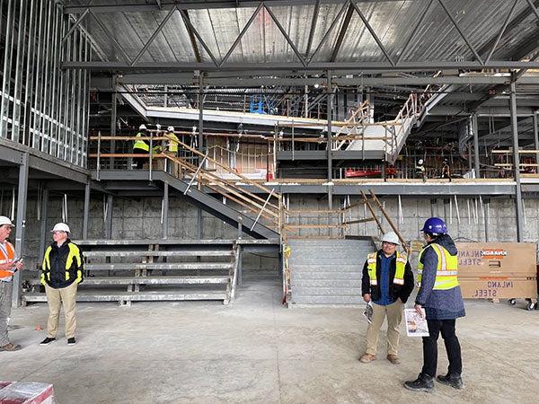 a partially completed stair way with bleachers next to it