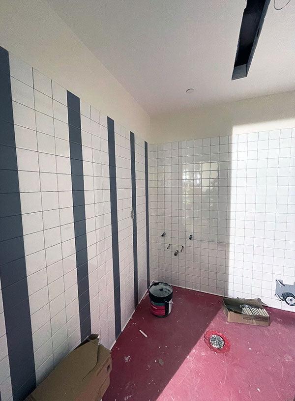 white tile wall with gray tile stripes