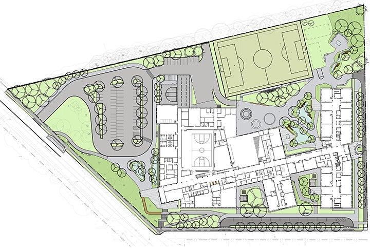 a drawing showing a school site with a building, parking, and green spaces