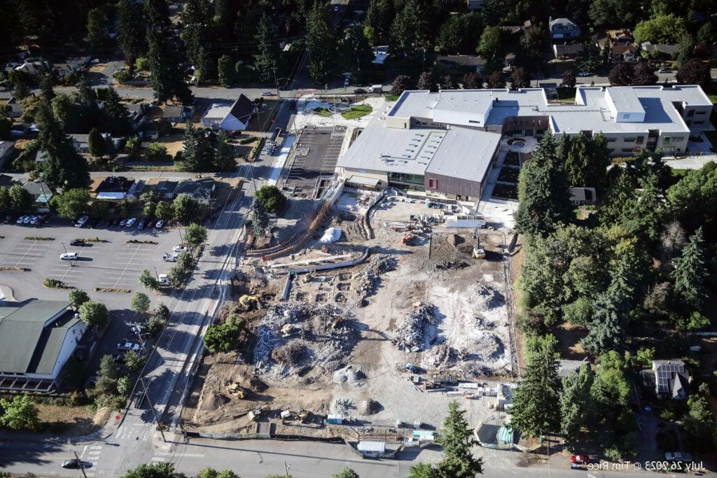 aerial view of a construction area next to a new building
