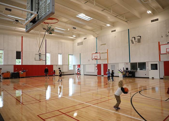 a gymnasium with children playing