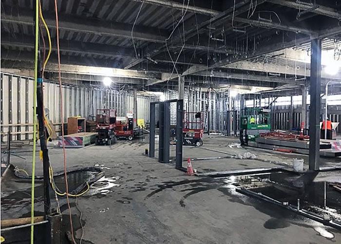 inside a large building under construction with no walls yet